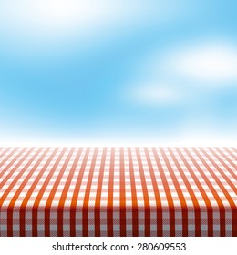 Vector Picnic Table Covered With Tablecloth On Blue Sky Background With Blurred Clouds.