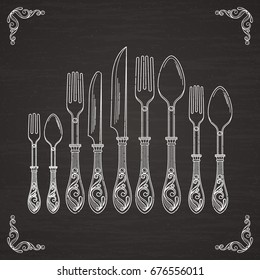 Vector pictures of spoon, fork and knife. Tableware hand drawing silhouette on black chalkboard
