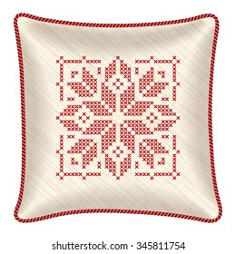 Vector pillow with embroidered pillowcase. Traditional Scandinavian ornament for Christmas - bright red and white snowflakes in cross stitch pattern. Vector illustration.