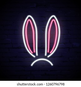 Vector pink and white neon rabbit ears isolated on dark brick background