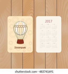 Vector pocket calendar for 2017 with steampunk vintage hot air balloon in doodle style