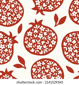 Vector pomegranate seamless pattern. Fruits and seeds on beige background. Creative print for textile, wrapping paper, cosmetics, healthy food.