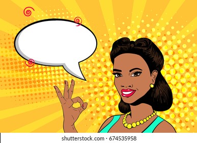 Vector pop art sexy young african woman smiling and showing ok sign. Empty speech bubble. Colorful background in retro comic style.