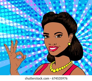 Vector pop art sexy young african woman smiling and showing ok sign. Colorful background in retro comic style.