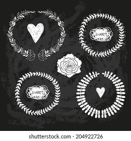 vector popular hipster chalk doodle sketch of wreath with rose, heart and cloud on chalkboard