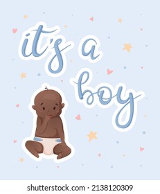 Vector postcard or banner with a newborn African American boy and lettering inscription it's a boy.