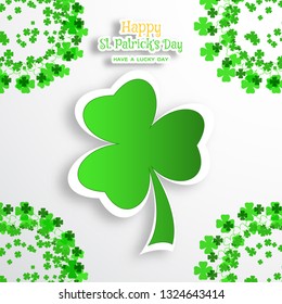 Vector poster of Happy St. Patrick's Day  on the gradient background with green leaf of clover and text cuted from paper, shadow and clover leaves arranged at the corners.