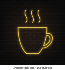 Vector poster of neon light cup with steam on grunge brick wall background. Bright yellow cup of coffee or tea silhouette in retro style. Glowing banner for your own projects. EPS 10 file.