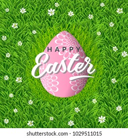 Vector poster with realistic egg in grass with chamomiles. Green background with handwriting inscription Happy Easter