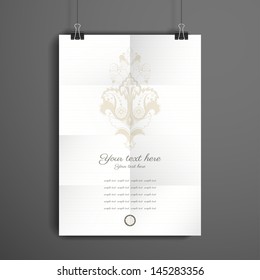Vector poster. Sheet of paper folded in eight.  The paper hangs on the clamps. Vintage floral pattern. Place for your text.