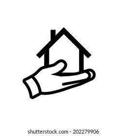 vector real estate house in hand icon | modern flat design black pictogram of hand holding house isolated on white background