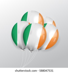 Vector realistic balloons with Irish flag on the gray background. Concept of Happy St. Patrick's Day.