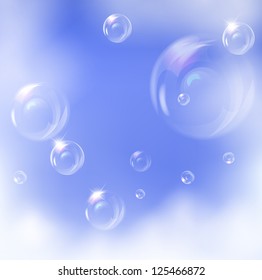Vector realistic bubbles against blue sky background.