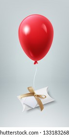Vector realistic illustration of small present box with gold bow and paper card on red balloon isolated on light gray background