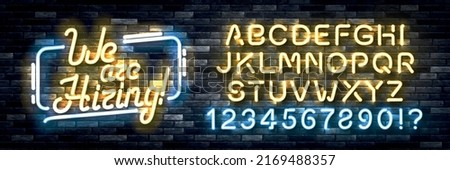 Vector realistic isolated neon sign of We Are Hiring with easy to change color alphabet on the wall background.