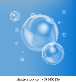 Vector realistic soap balls, bubbles on a blue background