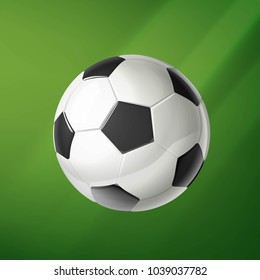 Vector realistic soccer ball on a green background