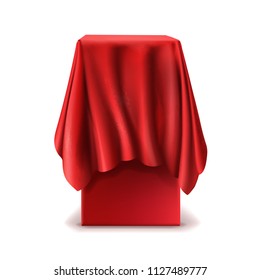 Vector realistic stand covered with red silk cloth isolated on white background. Empty podium, tribune with tablecloth for speech or presentation. Secret box, hidden under satin fabric with drapery