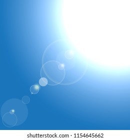 Vector Realistic sun burst with flare on blue background.
