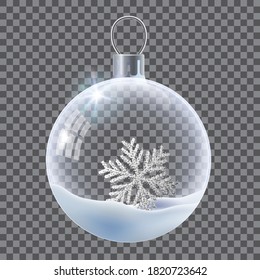 Vector realistic transparent Christmas ball with snow and snowflake. Template of glass transparent Christmas ball. Vector object for design, mock-up. Shiny toy with silver glow.