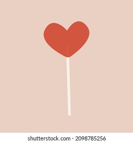 Vector red lollipop in the shape of heart on a stick