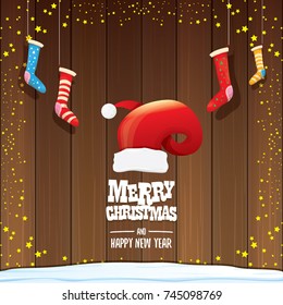 vector red Santa hat  with christmas socks and greeting text Merry Christmas and Happy new year on wooden background. vector merry christmas greeting card, banner design template or xmas background. 