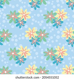 Vector repeat floral pattern with multicolor daisies on a polka dotted pale blue backdrop