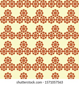 Vector repeat pattern of geometric flower in brown and yellow colors.
