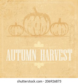 vector retro card with a picture of the hand of the pumpkin and the words Autumn Harvest