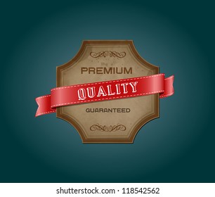 Vector retro vintage old label with texture and stains, decorated with red satin ribbon. "Premium Quality Guaranteed"