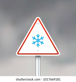 Vector road sign with snowflake on gray sky background
