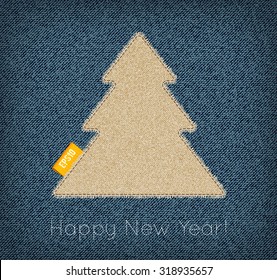 Vector rough canvas stitched new year tree with fringe and a tag on a blue denim background