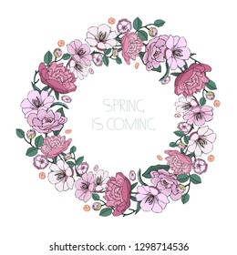 Vector round frame, detailed wreath of garden and wild flowers isolated on white. Lettering Spring Is Coming in the center.
Great for greeting cards, business cards, posters, banners.