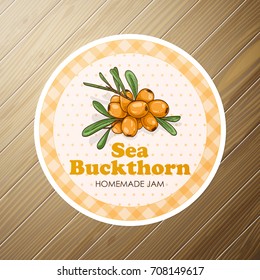 Vector round label, sea buckthorn jam on a wooden background