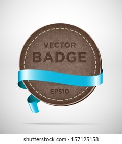 Vector round vintage leather badge with blue silky ribbon