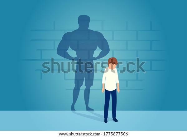 Vector of a sad weak\
man teenager standing depressed in front of a wall with his strong\
shadow of himself