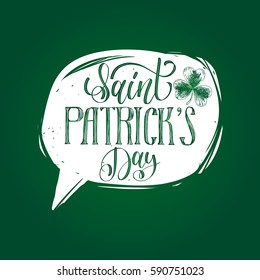 Vector Saint Patrick's Day hand lettering greetings card or poster. Ornate calligraphy in speech bubble for irish holiday design concepts. Festive typography on green background. 