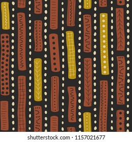 Vector seamless aboriginal pattern including ethnic Australian motive with brown and yellow typical elements of dots, lines, lattice and arrows on dark grey background
