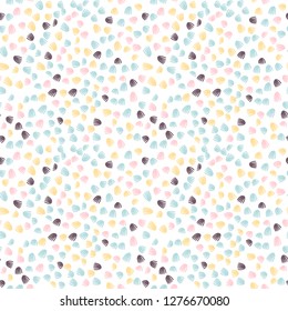 Vector  seamless abstract background with small pastel colored elements, freehand doodles pattern.