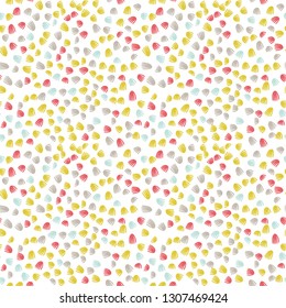 Vector  seamless abstract background with small pastel colored elements, freehand doodles pattern.