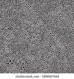 Vector seamless abstract pattern from black round spots on a white background. Animal print, wallpaper, batik paint, wrapping paper, Fashionable grunge textile print
