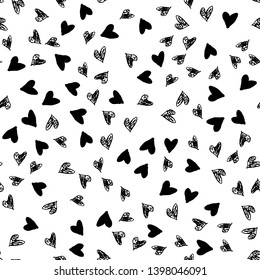 Vector seamless abstract pattern. Hand-drawn different random placed black hearts texture isolated on white. Freehand drawing diffused spots. Wallpaper, paper, fabric, textile, wrapping paper design.