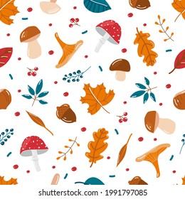 Vector seamless autumn background of leaves, mushrooms and berries. Fall elements on a white background.