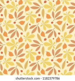 Vector seamless autumn pattern with leaves and rowan berries on yellow background