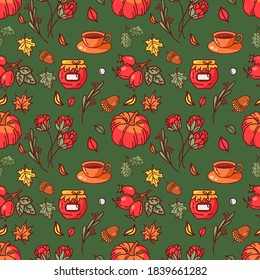 Vector seamless autumn pattern on a green background. Maple leaves, rose hips, a mug of tea, jam, pumpkin, acorn, artichoke flowers. Perfect for printing on fabric, paper.