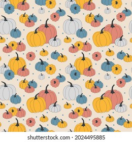 Vector seamless autumn pattern of orange, red, blue, and grey pumpkins stylized in a flat and doodle style in the light background. Hand-drawn fall texture.Background for textile wallpapers
