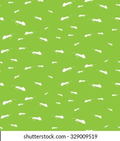 Vector seamless background of ants. Chaotic ants on a green background.