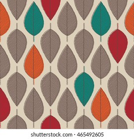 vector seamless background with autumn colored leaves