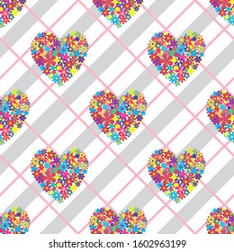 Vector seamless background with bright hearts made of flowers.