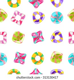 Vector seamless background with colorful candies on a white background.